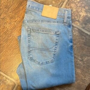 Hollister Blue Jeans with Classic Faded Look and Contrasting Stitching